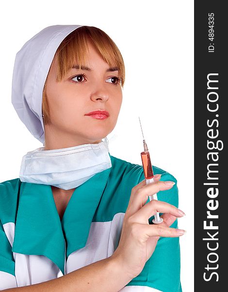 The young nurse with a syringe in a hand.