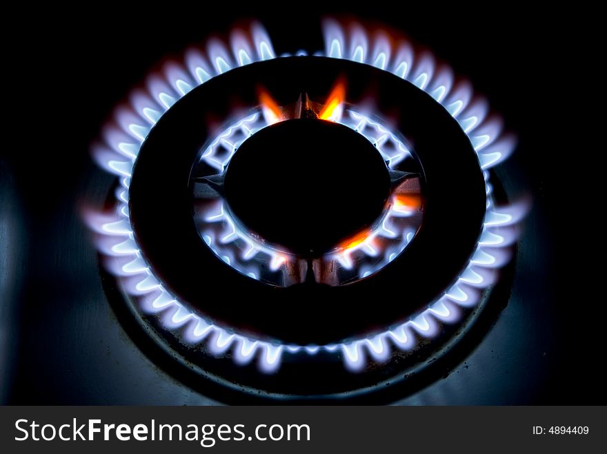 Flames of gas stove in the dark