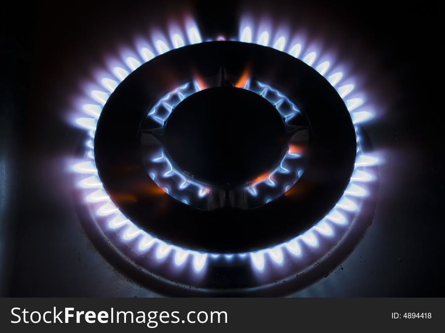 Flames of gas stove in the dark