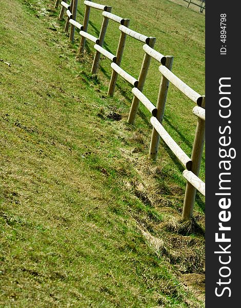 Wooden Fence On The Country Grass