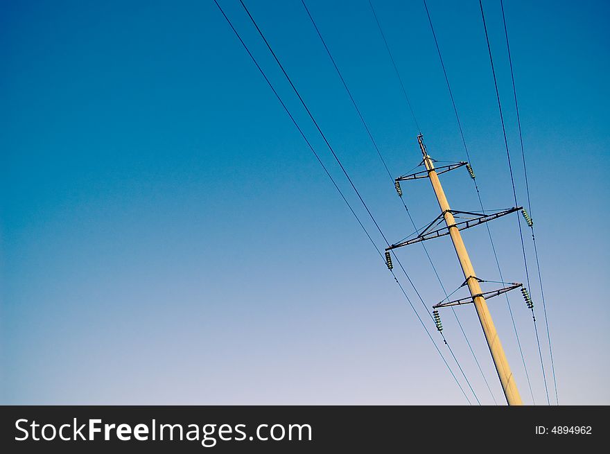 High voltage electricity pylon and blue sky. High voltage electricity pylon and blue sky