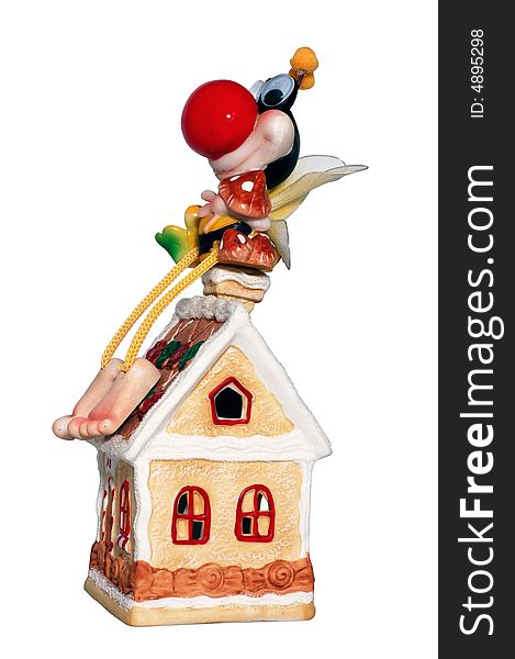 The greater cheerful bee with fly agarics sits having lowered legs on a pipe of a sugar small house. The greater cheerful bee with fly agarics sits having lowered legs on a pipe of a sugar small house.