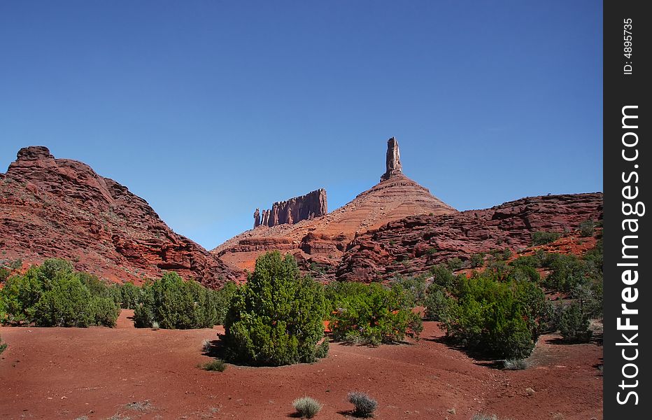 View of the red rock formations in Canyonlands National Park with blue skies. View of the red rock formations in Canyonlands National Park with blue skies