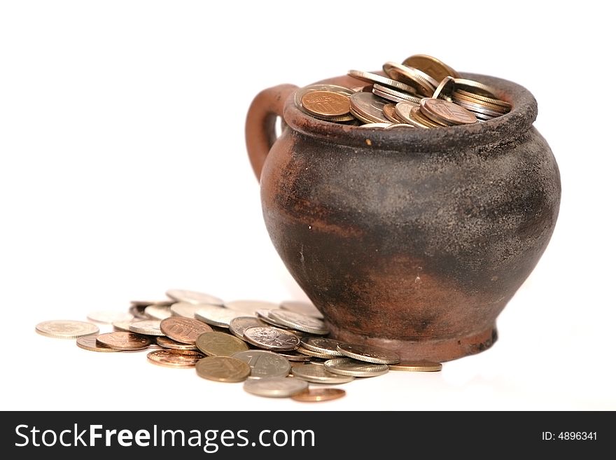 Coins in the clay jar. Coins in the clay jar