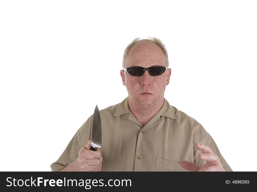 A man in sunglasses and a kitchen knife in an attack stance. A man in sunglasses and a kitchen knife in an attack stance