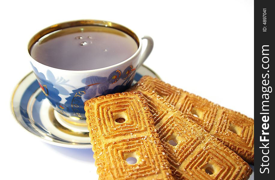 Cup of tea and  cookies isolated on a white background. Cup of tea and  cookies isolated on a white background