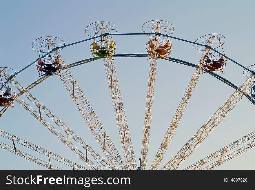 Carousel top path on blue sky. Carousel top path on blue sky