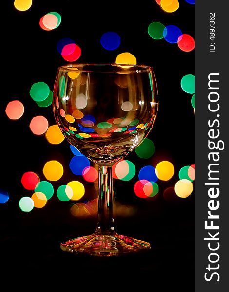 Wine glass with colored light spots. Wine glass with colored light spots