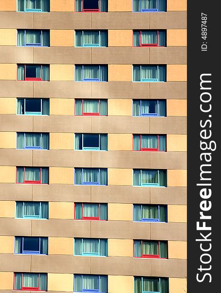 The wall and colorful windows of an modern urban hotel. The wall and colorful windows of an modern urban hotel