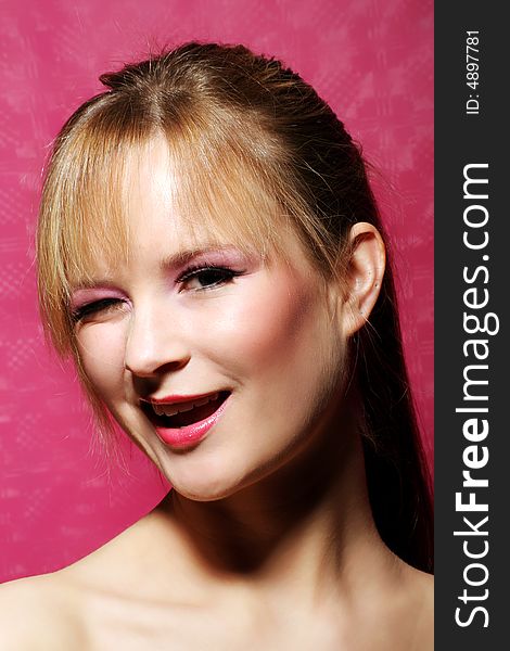 Beauty portrait of a young woman is winking. Beauty portrait of a young woman is winking