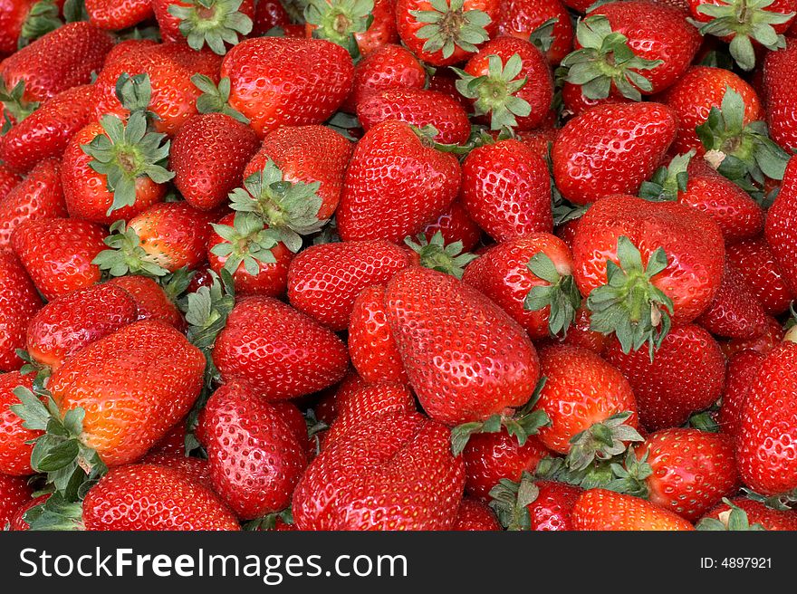 Heap of  red strawberries at the market