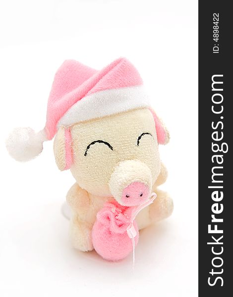 Small pink soft toy a pig with pink packet in hands. Small pink soft toy a pig with pink packet in hands