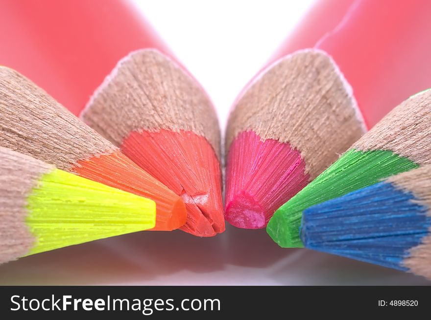 Colour pencils on white background. Close-up. Macro.