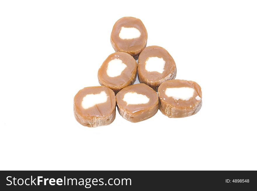 Brown carmel candy pyramid with white centers. Brown carmel candy pyramid with white centers