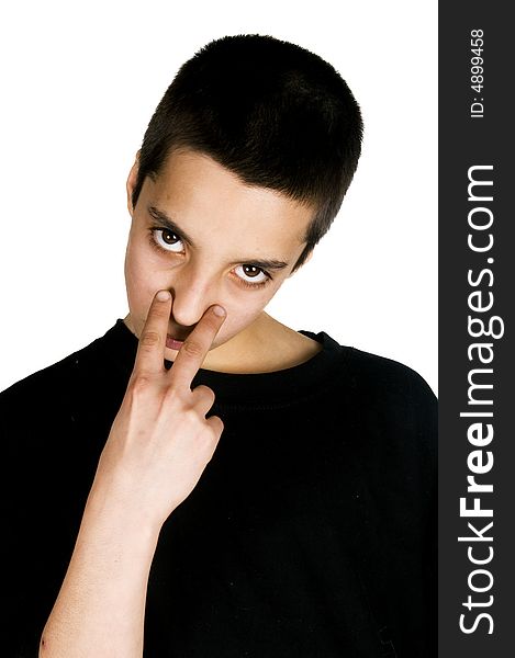 Young teenage boy pointing to his eyes