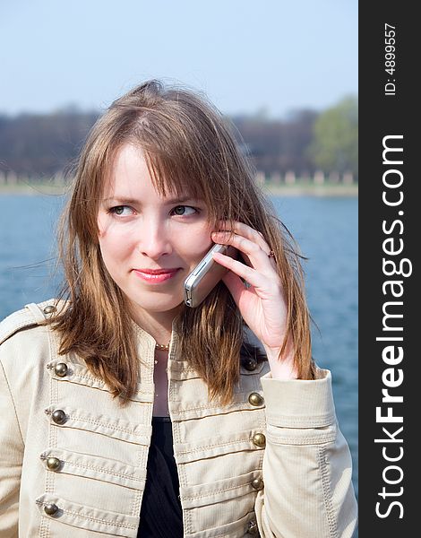 The young woman talking on a mobile. The young woman talking on a mobile