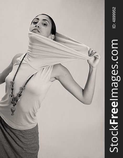 Portrait of hispanic fashion model pulling her clothes. Portrait of hispanic fashion model pulling her clothes