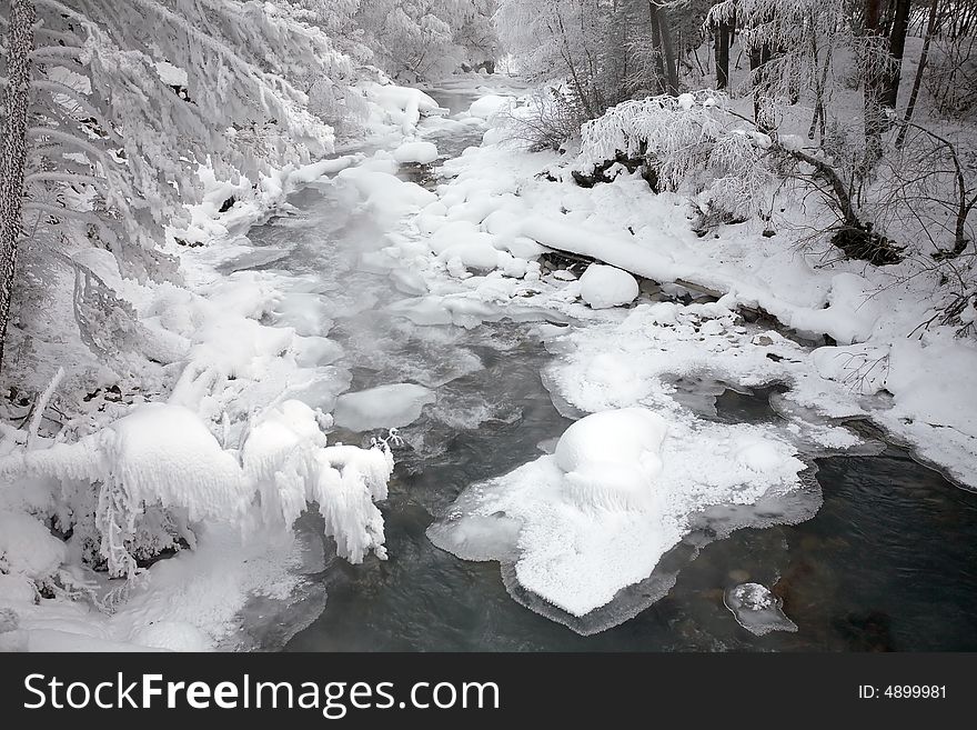 Winter frozen river in mountains. Winter frozen river in mountains