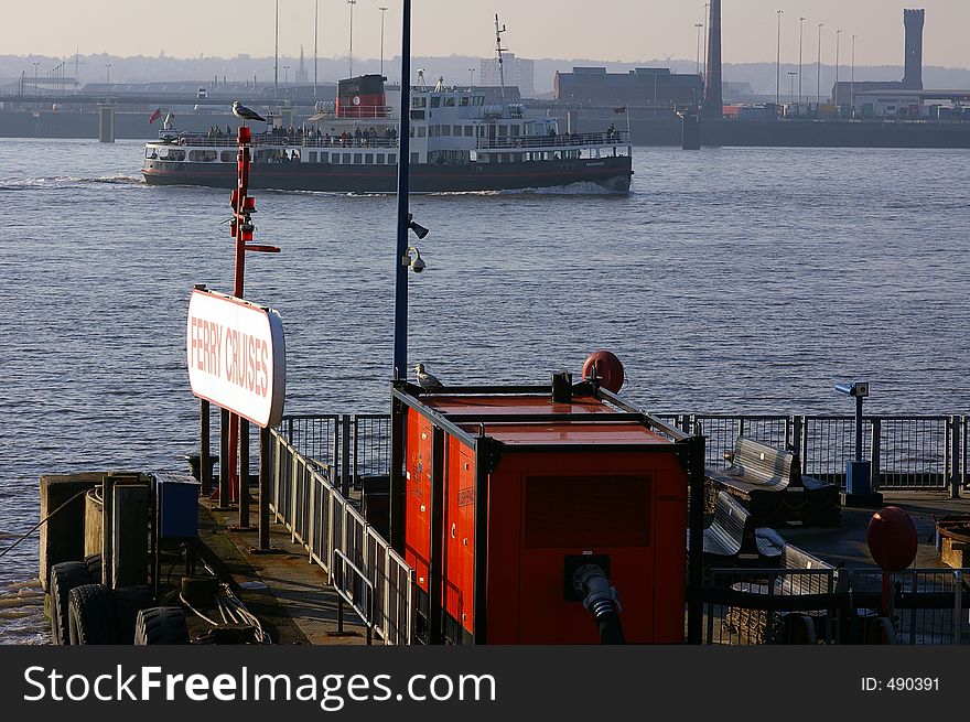 A ferry boat on the River Mersey in Liverpool coming in to tie-up at the floating landing stage. A ferry boat on the River Mersey in Liverpool coming in to tie-up at the floating landing stage.