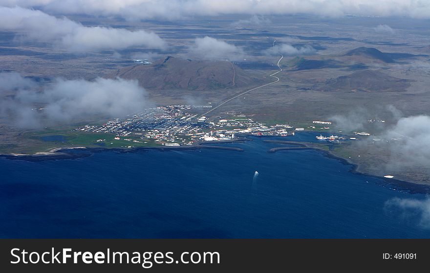 Port Town With Blue Lagoon In Background