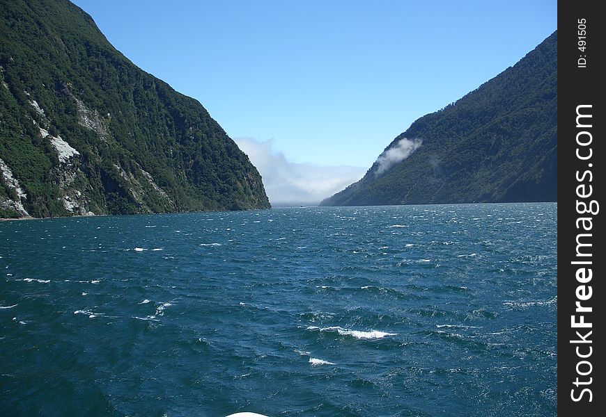 This is taken on a boat trip in the Milford Sound. This is at the exit to the ocaen. This is taken on a boat trip in the Milford Sound. This is at the exit to the ocaen