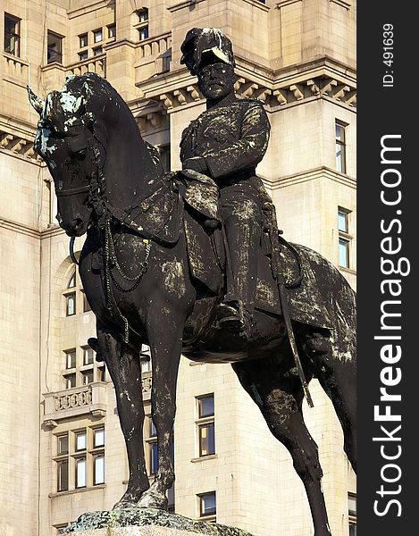 A memorial statue of King Edward VII of Britain outside the Royal Liver Buildings in Liverpool. A memorial statue of King Edward VII of Britain outside the Royal Liver Buildings in Liverpool.