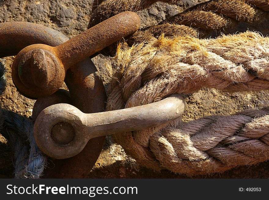 Ropes tieing up a ship to a mooring against the dock wall in Liverpool. Ropes tieing up a ship to a mooring against the dock wall in Liverpool.