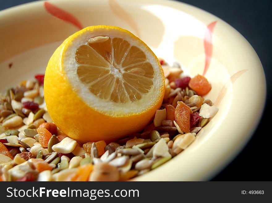 This is a image of a lemon in a cereal bowl. This is a image of a lemon in a cereal bowl.
