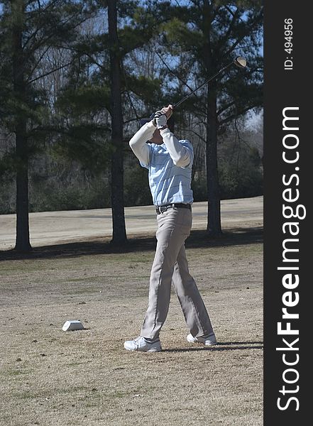 Senior Golfer teeing off at the white tee