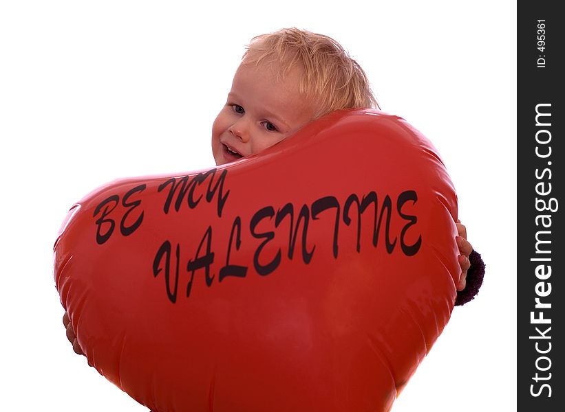 Little 2-year old holding a valentine heart. Little 2-year old holding a valentine heart.