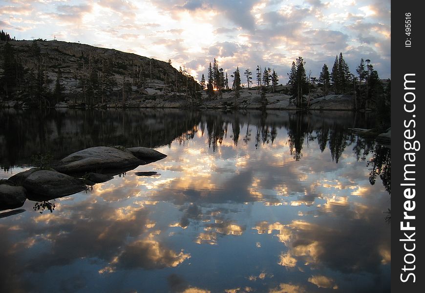 Unique reflection at sunrise in the high sierras, backpacking trip near Lake tahoe in Northen California. Unique reflection at sunrise in the high sierras, backpacking trip near Lake tahoe in Northen California.