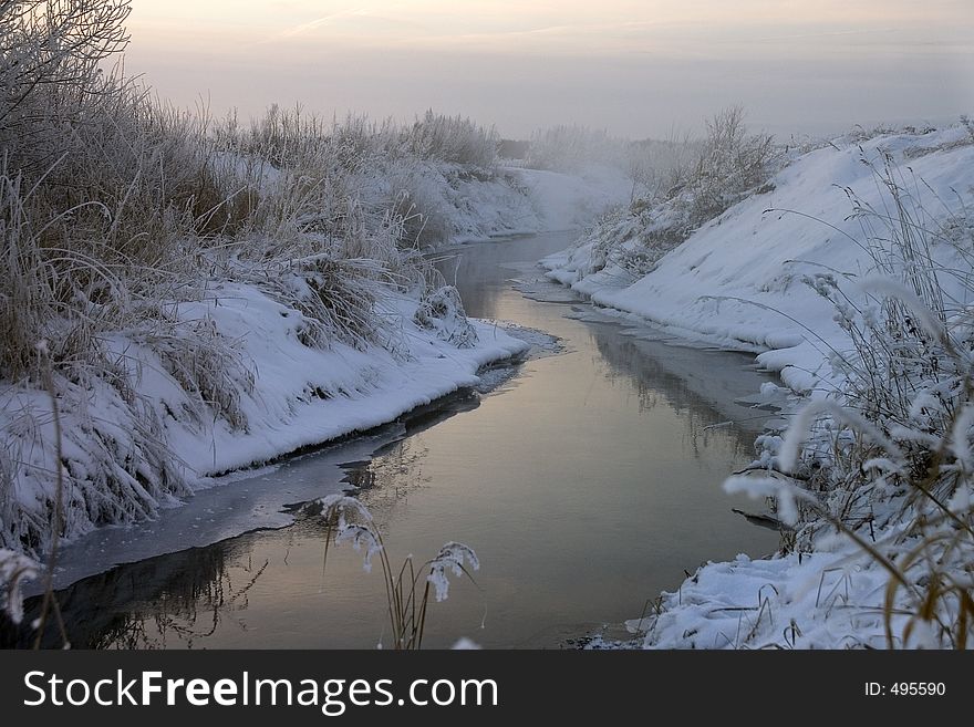 Steamy river (air -26C) in dim dawn light. Steamy river (air -26C) in dim dawn light