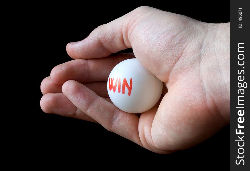 Hand holding lottery ball. Isolated on black. Blank winner lottery ball. Choose win ball. Lucky winning concept. Word win. Hand holding lottery ball. Isolated on black. Blank winner lottery ball. Choose win ball. Lucky winning concept. Word win