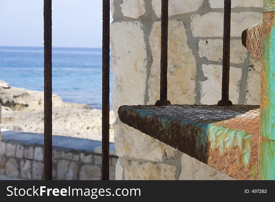 Ocean view through a set of spiral stairs. Ocean view through a set of spiral stairs