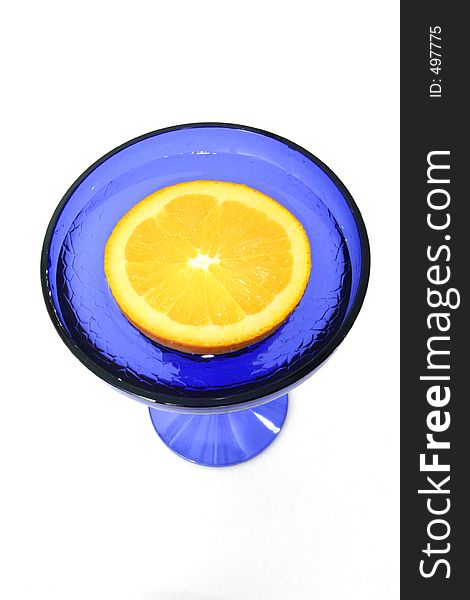 Half An Orange In A Blue Glass