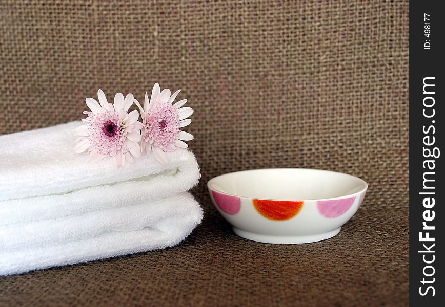 Two white towels and dish at a day spa