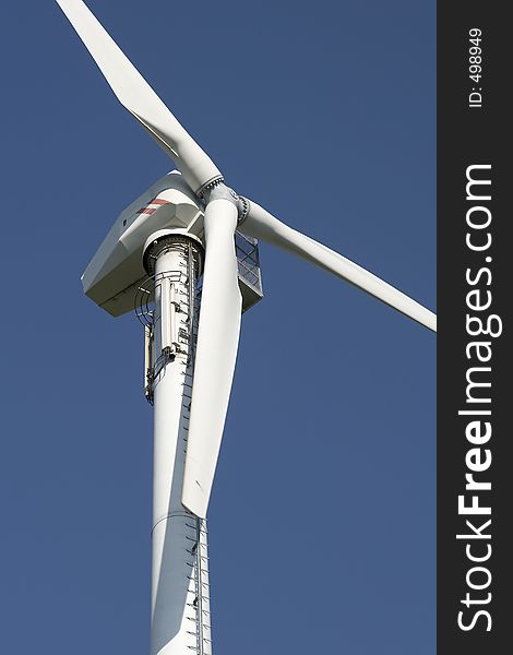 Detail of wind turbine against a blue sky. Detail of wind turbine against a blue sky