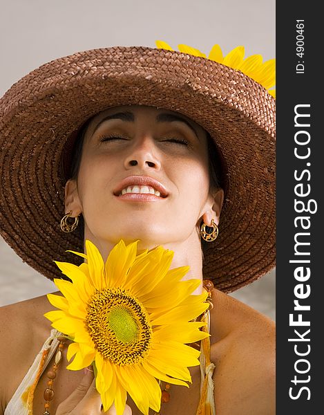 Portrait of young hispanic woman holding sunflower. Portrait of young hispanic woman holding sunflower