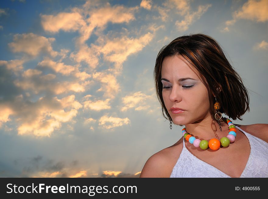 POrtrait of beautiful woman against sunset sky background. POrtrait of beautiful woman against sunset sky background