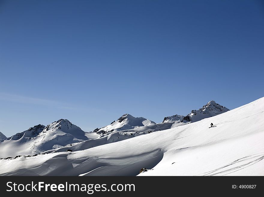 Ski freeride in high mountains, sky, winter