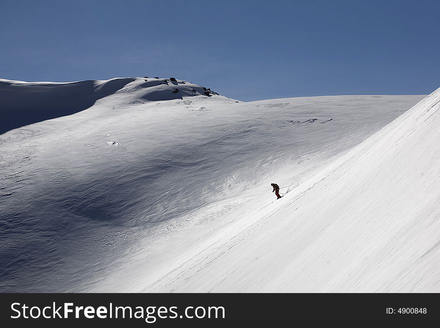 Ski freeride in high mountains, sky, winter