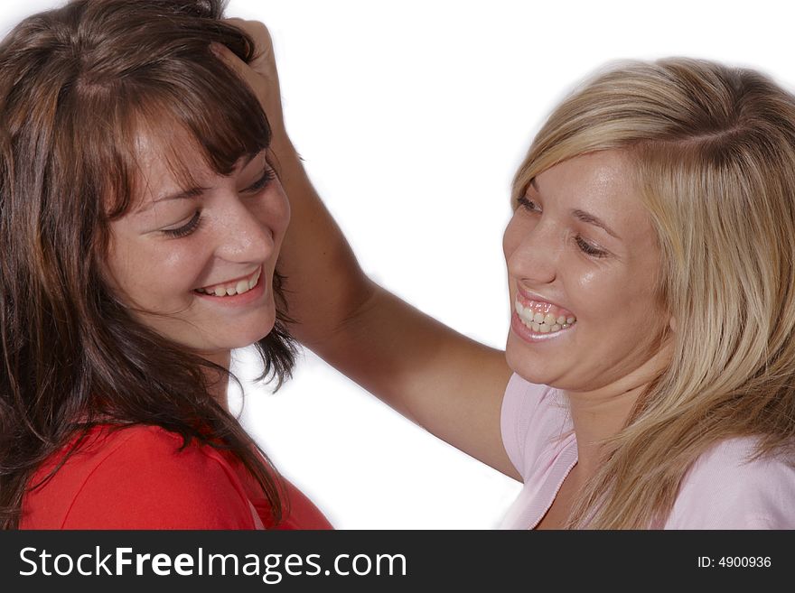 Playful girls pulling hair