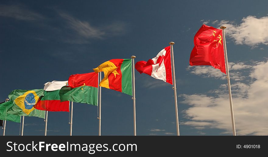 Photo of colorfull flags in a sunny windy day. Photo of colorfull flags in a sunny windy day