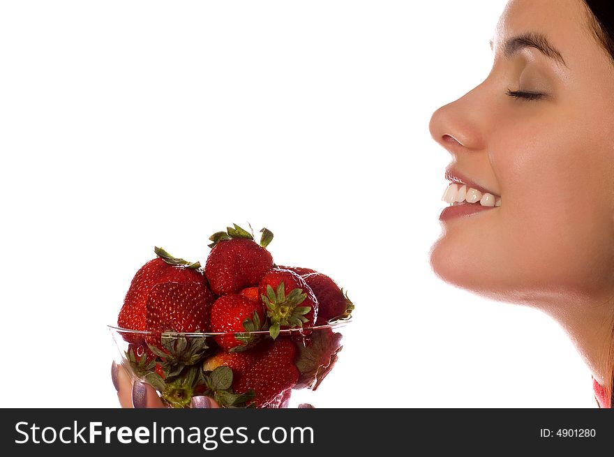 Young girl with a fresh strawberries (isolated on white)