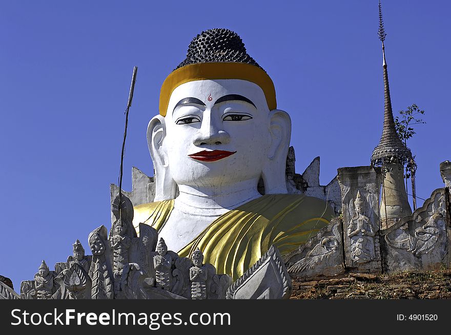 Myanmar, Inle Lake:  blue sky and buddha images at Nanthe Paya. Myanmar, Inle Lake:  blue sky and buddha images at Nanthe Paya