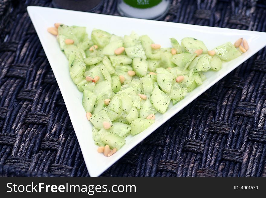 A Salad of fresh cucumbers and pine corns