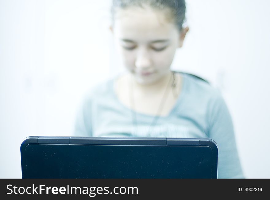 Teen Working On Laptop Computer