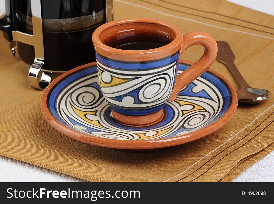 Freshly brewed coffee served in a ceramic cup. Freshly brewed coffee served in a ceramic cup.