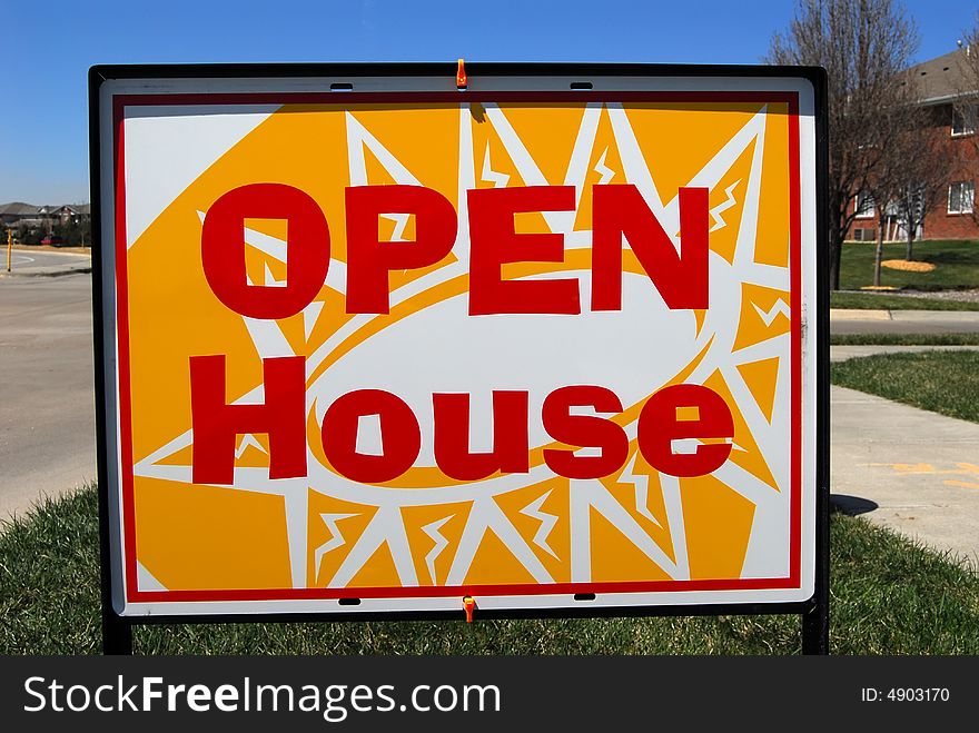 Sign for open house outside apartment complex. Sign for open house outside apartment complex.