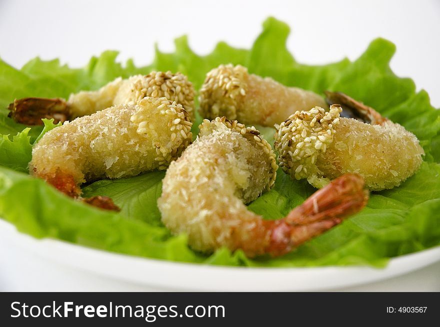 A close-up shot of shrimps on salad. A close-up shot of shrimps on salad